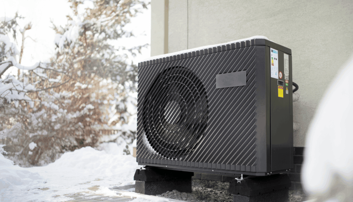 a heat pump outside of a home in the winter