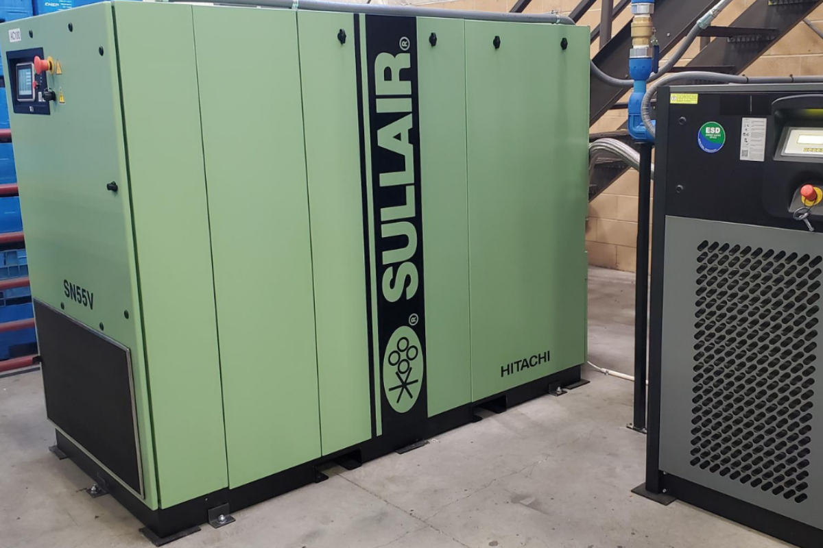 a Sullair Industrial compressed air system inside of a manufacturing plant.