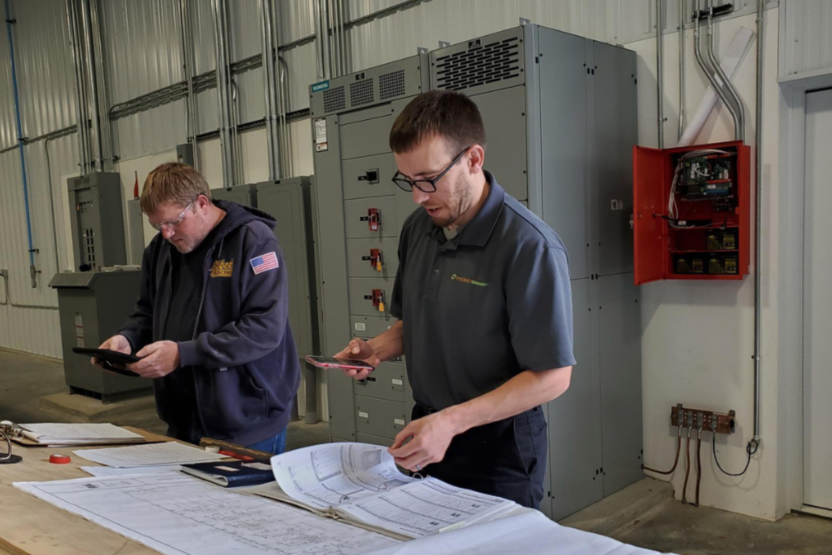 an Efficiency Smart consultant working with a client in a warehouse.
