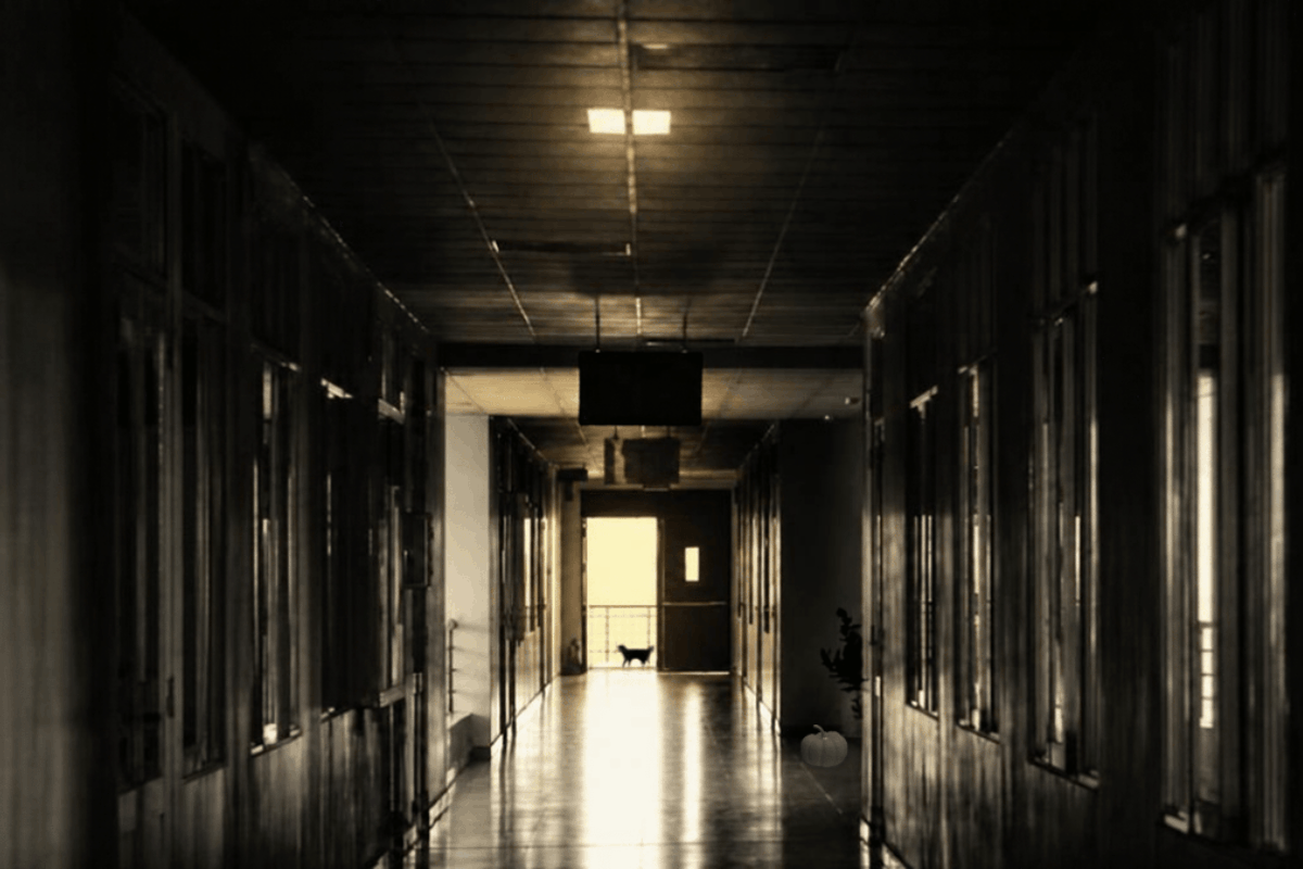 a hallway in a business with poor lighting and an eerie glow