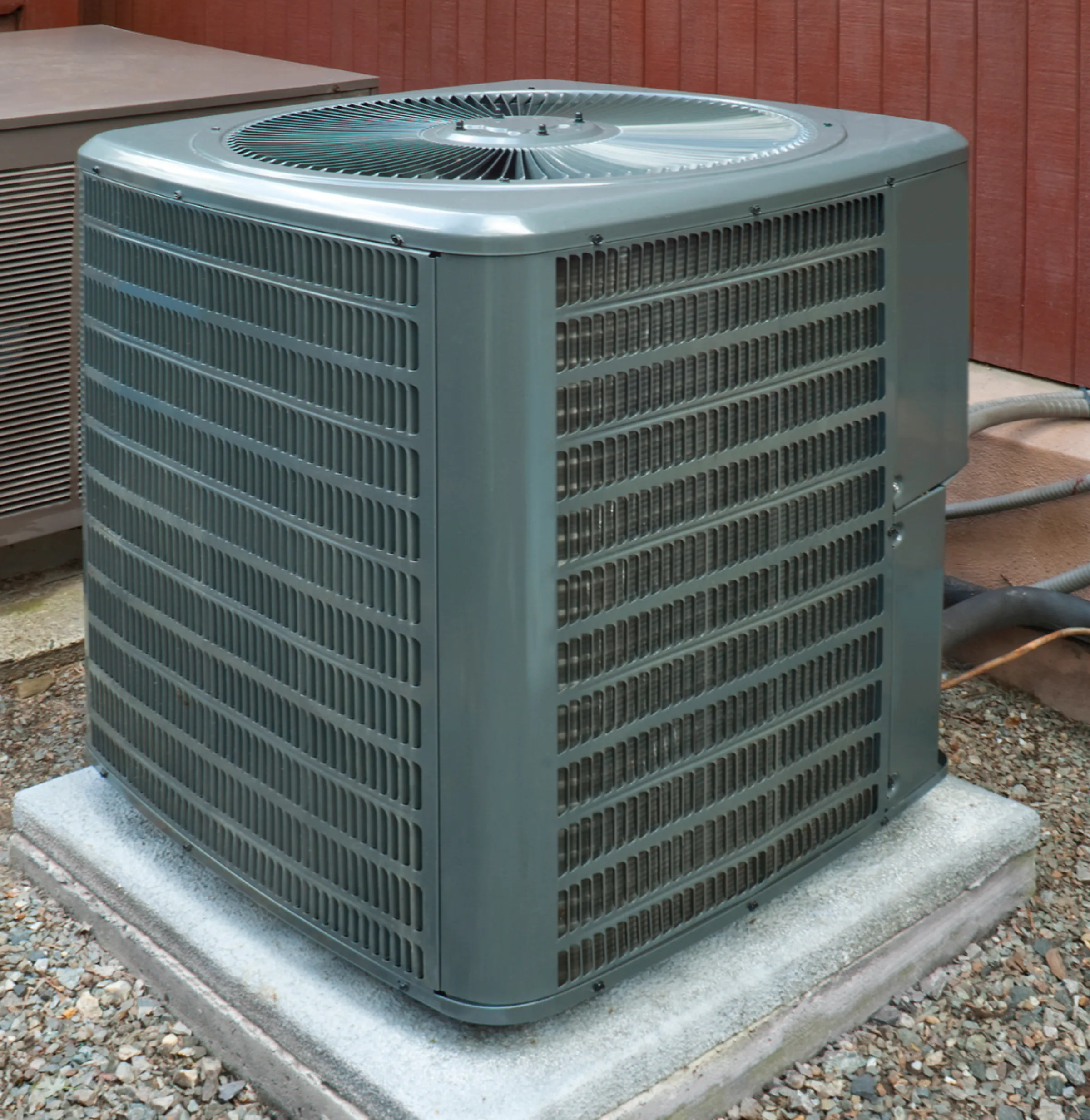 an air source heat pump unit installed outside of a home.