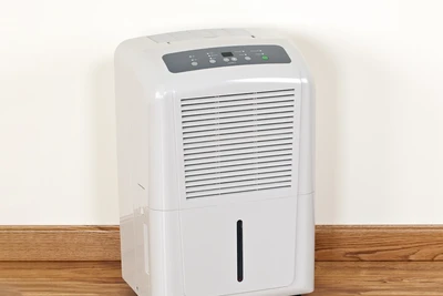 a dehumidifier on the floor of a home.