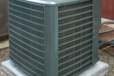 an air source heat pump unit installed outside of a home.